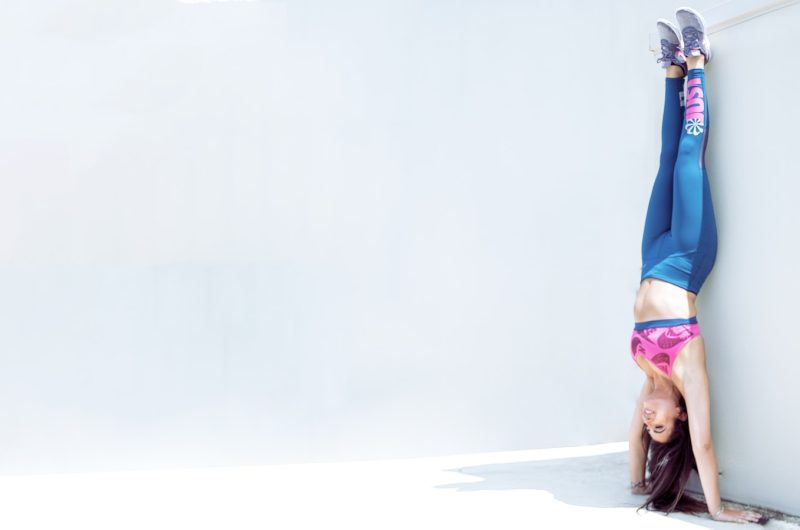 person in blue pants and pink shoes